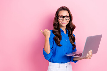 Sticker - Photo of gorgeous smart woman with curly hairdo dressed blue blouse directing empty space hold laptop isolated on pink color background