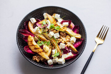 Wall Mural - Roasted pear and chicory salad with walnuts and feta cheese