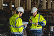 © chokniti - professional technician engineer with safety hard hat working to maintenance construction equipment in industrial factory, inspection man having manufacturing occupation job of production technology