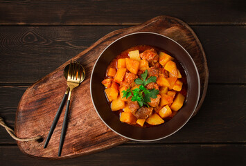 Wall Mural - Potatoes stewed with meat, in tomato sauce, with spices and herbs, no people,