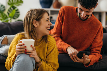 Wall Mural - Happy couple has a pleasant conversation at home