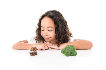 Wall Mural - Child girl with Cupcake and broccoli on white background