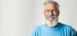 © Robert MEYNER - Mature, bearded man with a cheerful smile wearing a sweatshirt stands alone on a white background, looking at the camera mid-aged, gray-haired senior hipster with Generative AI technology