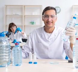 Two chemists working in the lab