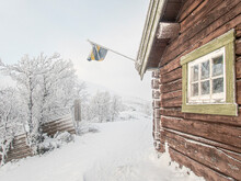 Frozen Hut With A Swedish Flag