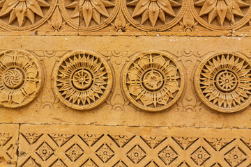 Wall Mural - Thatta, Sindh, Pakistan - October 2021: Beautiful traditional intricate geometric and floral carved stone detail, decoration, in a royal mausoleum in Makli necropolis