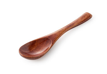 Wall Mural - A wooden spoon placed on a white background.