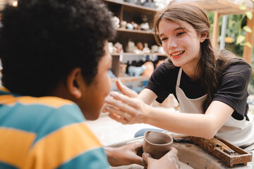 Wall Mural - happy smiling girl having fun to learning and work with craft art of clay hand-made workshop in ceramic studio, little ceramist enjoy in creative handcraft hobby with pottery artisan school class