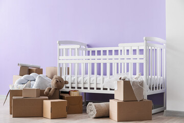 Canvas Print - Cardboard boxes with baby crib in children's bedroom on moving day