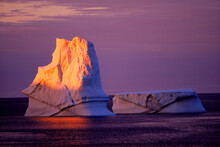 An Iceberg Grounded Off Quirpon Island Glows In A Sunset On The North Atlantic Coast Of Newfoundland.