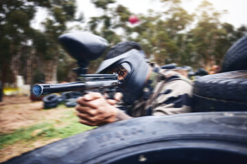 Poster - Paintball, gun or man playing a shooting game with fast action on a fun battlefield on holiday. Military mission, fitness or player aiming with weapons gear for war survival in an outdoor competition