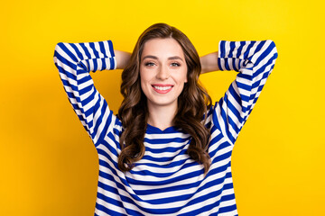 Poster - Photo portrait of lovely young lady arms behind head have rest sleepy wear trendy striped outfit isolated on yellow color background