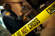 © Cavan Images - Caution tape at a crime scene.