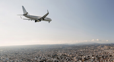 Passengers commercial airplane flying above Limassol city, Cyprus