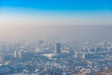 Fototapeta Uliczki - View of the city Almaty from above during the smog in winter. Kazakhstan