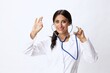 © SHOTPRIME STUDIO - Woman doctor with stethoscope in hand in medical gown on white nurse background, consequences of covid-19, noise in lungs, concept of health and science