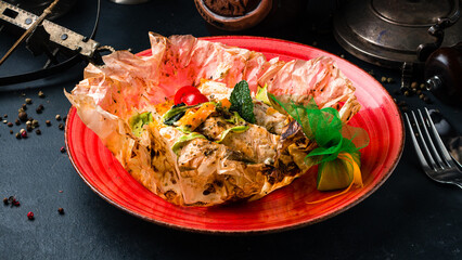 Poster - Lunch baked chicken fillet with spices, chili peppers, sweet peppers, tomatoes and herbs in parchment.