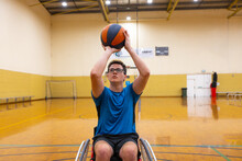 Basketball Player In Wheelchair Shooting Ball