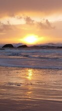 Vertical Video Of Beautiful West Coast Sunset Rocky Beach In Bandon Oregon. 