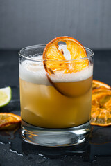 Sticker - Fresh alcoholic cocktail Whiskey Sour from whiskey, egg white, lemon juice, syrup and lime garnished with an orange slice.