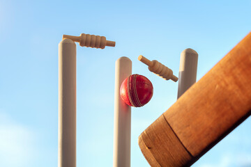 Canvas Print - Cricket ball hitting wicket stumps knocking bails out