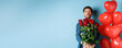 Romantic boyfriend confessing in love and giving bouquet of roses, pucker lips for kiss, standing with heart balloons on blue background