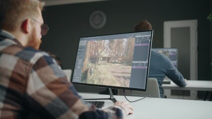 game development process, man creating Level design by modern software, working in office coworking