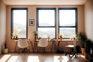 Cozy, Modern home workplace sitting area with desk and plants and a couch and wood floor, windows with natural light rays and long shadows.
