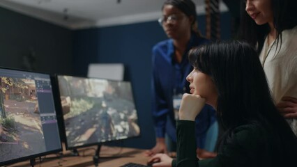 professional video game developer creating new interface adn virtual reality on computer in office