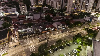 Wall Mural - Top view of vehicle traffic on an avenue with a bus lane during dusk in the city of Sao Paulo