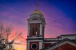 the bell tower at Cathedral-Basilica of the Immaculate Conception with powerful clouds at sunset in Mobile Alabama USA