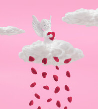 Love Composition Made Of White Angel Figure With Red Hearts And Clouds On Pink Background. Minimal Concept Of Valentine's Day Or Love. Creative Art, Minimal Aesthetics.