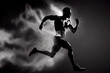 © surassawadee - Abstract silhouette of a running athlete man on the dark, black background