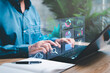 © NongAsimo - Smart digital marketing data management concept, Businessman use the laptop to work marketing analysis chart strategic planning for sustainable development and financial and investment competition