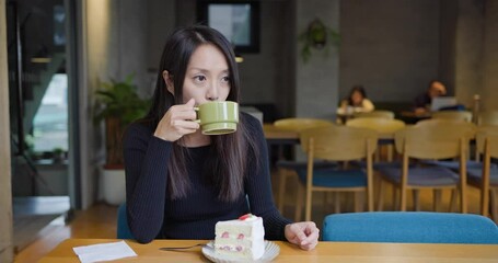 Sticker - Woman enjoy her coffee in cake shop