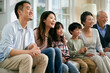 © imtmphoto - three generation asian family watching tv together at home