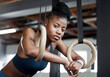 Break, gymnastics and portrait of a black woman with rings for training, muscle and arms at gym. Focus, strong and face of an African gymnast with performance during a workout or exercise at a club