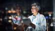 © C Malambo/peopleimages.com - Healthcare, tablet and thinking with a doctor woman at night, working overtime in the evening after dark. Medical, research or idea and a mature female medicine professional at work with a cityscape