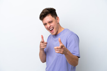 Young handsome Brazilian man isolated on white background pointing to the front and smiling