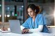 © C Malambo/peopleimages.com - Laptop, healthcare and doctor writing in notebook for medical research, planning and schedule in hospital. Telehealth, research and black woman with digital tech for online consultation in clinic