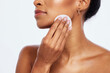 © Coetzee/peopleimages.com - Cotton, skincare and beauty of woman, cleaning and salon cosmetics on studio background. Face, toner and makeup pad for dermatology, aesthetic wellness and facial product natural results of body glow