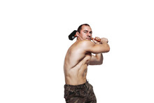 Strong Man With Naked Torso Who Swings A Sledgehammer While Isolated On White Background
