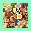 Essential fatty acid foods high in healthy lipids. Ingredients contain unsaturated good fats for healthy heart and cholesterol levels with nuts, seeds, dairy, vegetables, legumes and grain.  