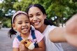 © Nina/peopleimages.com - Girl, mom and selfie of a mother and kids portrait in a park with a happy smile outdoor. Happiness, family and mama love with parent care for child on vacation together of a woman and young person