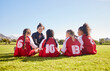 © Nina/peopleimages.com - Team building, planning or coach with children for soccer strategy, training and sports goals in Canada. Sport, friends and woman coaching group of girls on football field for game, match or workout
