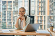 © Svitlana - Admirable businesslady posing at modern office desk with laptop