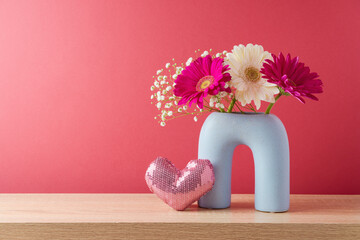 Wall Mural - Happy Valentine's day concept with spring flowers and heart shape on wooden table over magenta background