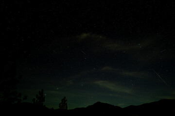 Wall Mural - On January 26, 2023, the rare green comet C/2022 E3 (ZTF) appeared with an earthgrazer meteor shower fireball outbreak. This image was taken at 06:42:02 PM PST (UTC-8) near Ashland Oregon.