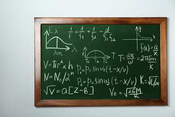 Wall Mural - Chalkboard with many different math formulas on white wall