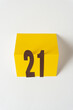 © eugen - the number 21 on a folded yellow card - macro lens, particular focus